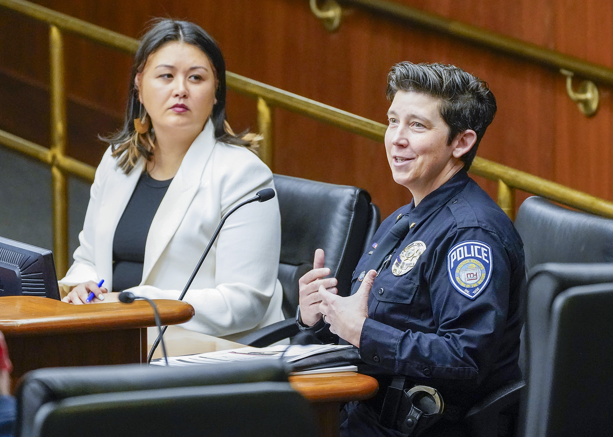 Mendota Heights Police Chief Kelly McCarthy testifies before the House transportation committee Feb. 29 in support of a bill sponsored by Rep. Samantha Sencer-Mura, left, that would authorize speed safety camera enforcement. (Photo by Andrew VonBank)